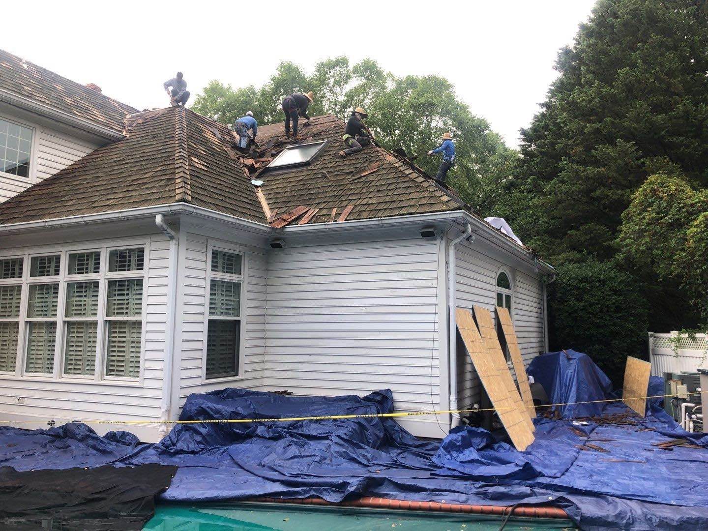 Emergency tarp installed after hours on a St. Louis roof