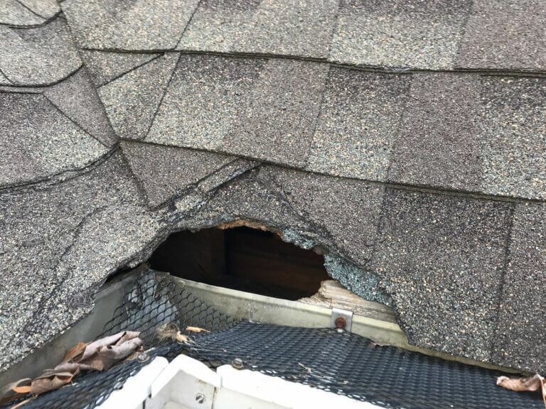 Hail-bruised shingles marked during a storm damage inspection in Arnold, MO, roofed by John Beal Roofing